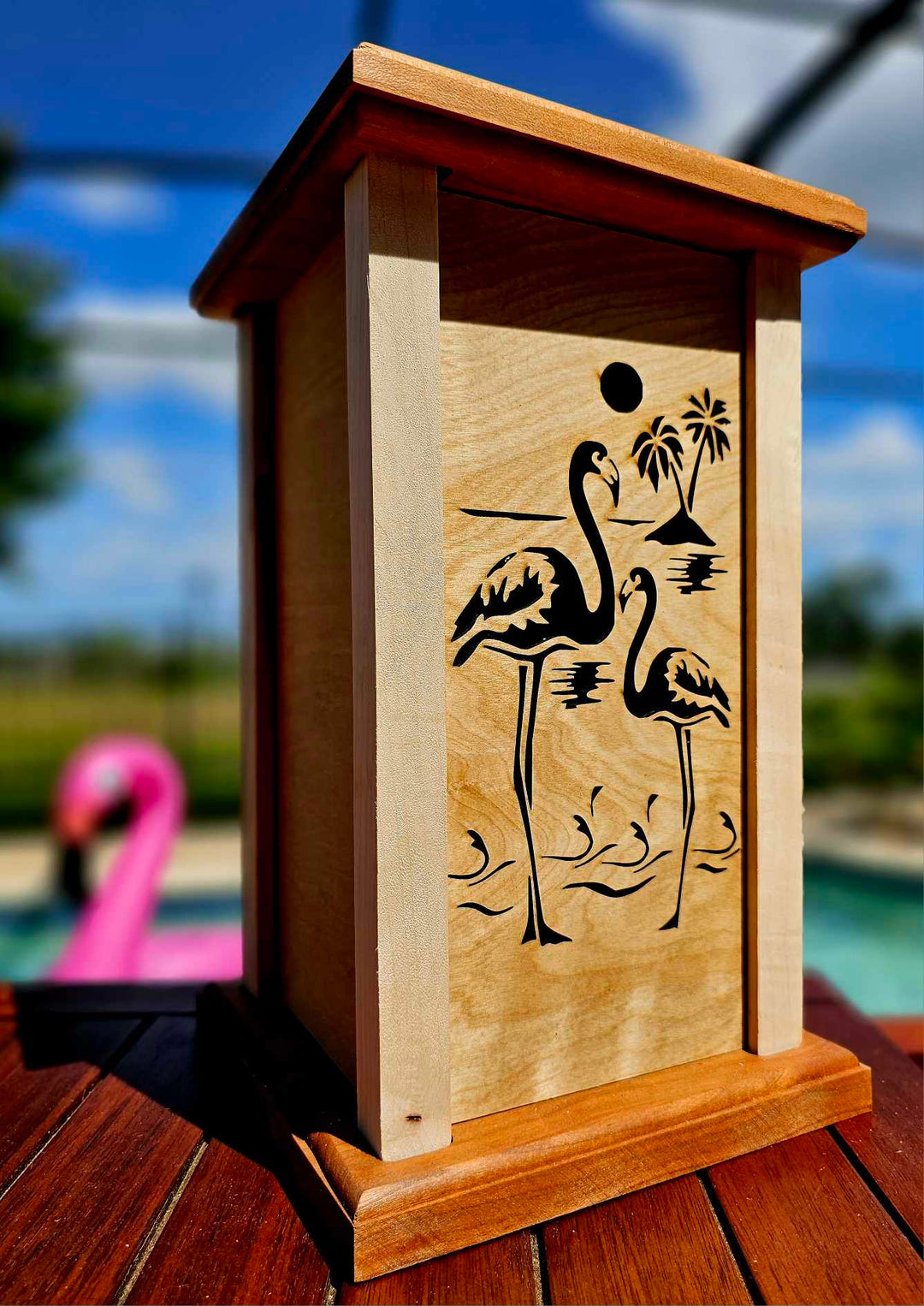 Wooden lantern with lantern face showing a summer theme.