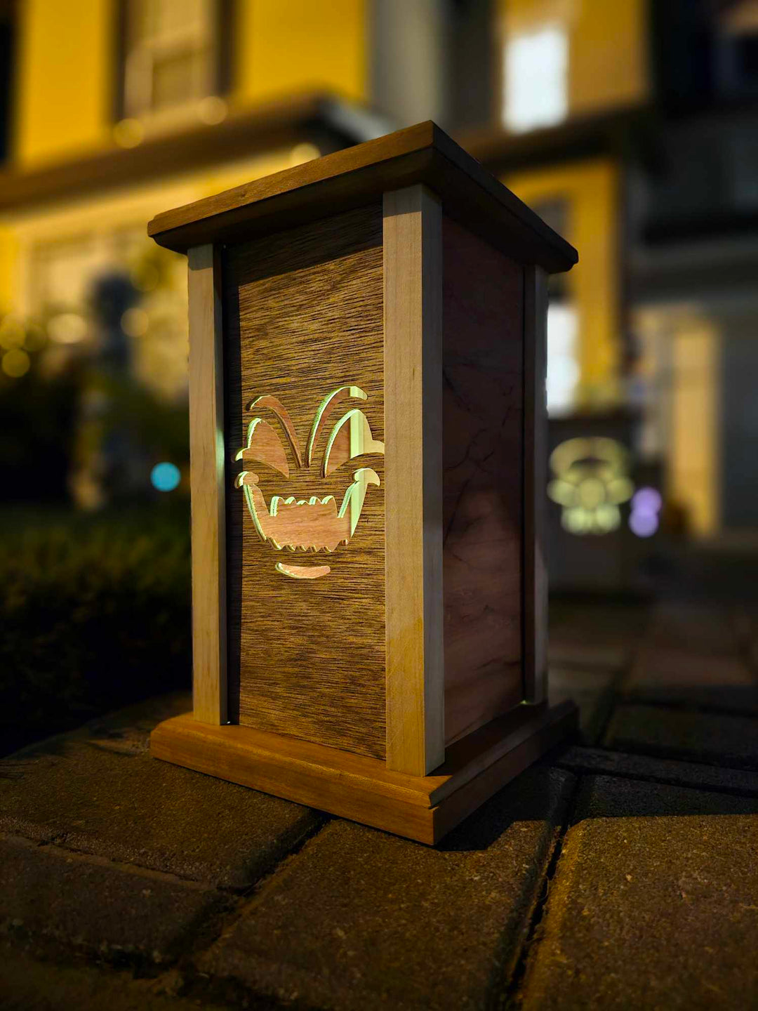 Wooden lantern face showing a demon face.