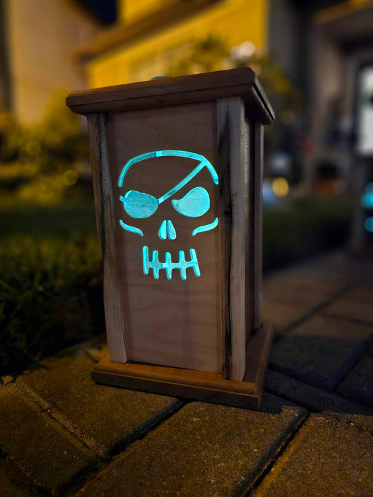 Wooden Lantern face depicting a pirate skull.
