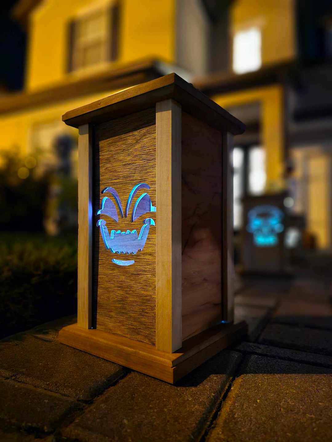 Wooden lantern face showing a demon face.