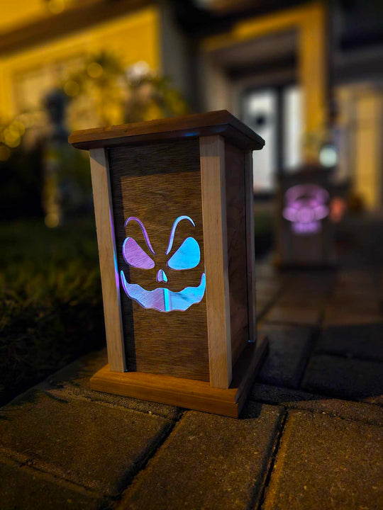 Wooden lantern face showing sinister smiling ghost.