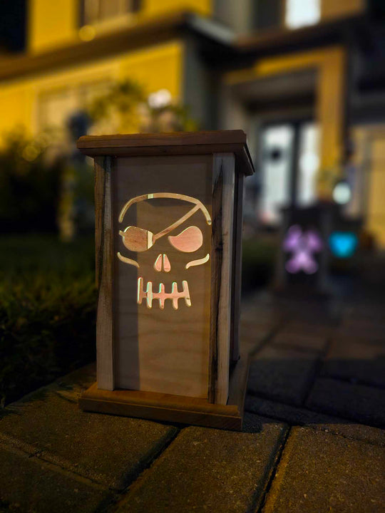 Wooden Lantern face depicting a pirate skull.