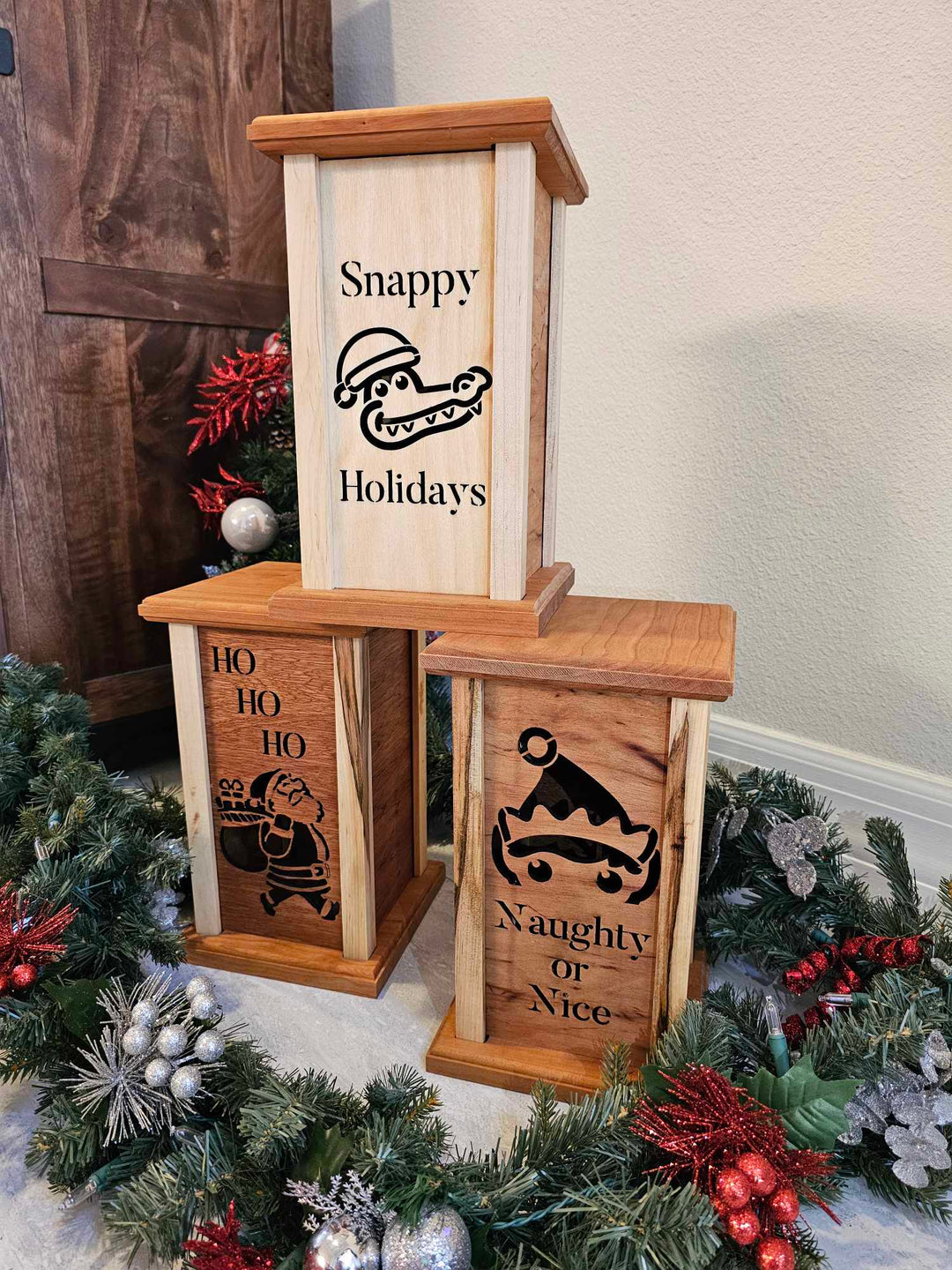 Wooden lanterns with Christmas themed lantern faces.