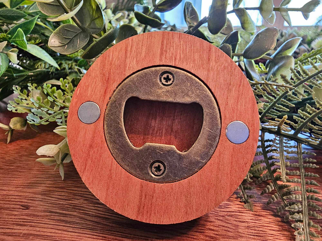 Back of wooden Puck-style bottle opener showing magnets and metal bottle opener.