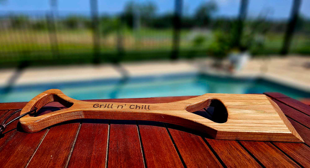 Hickory wood grill scraper with the words "Grill n' Chill.