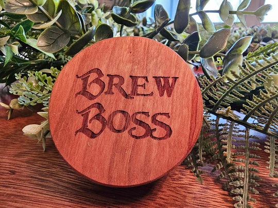 Wooden puck-style bottle opener with the words "Brew Boss".