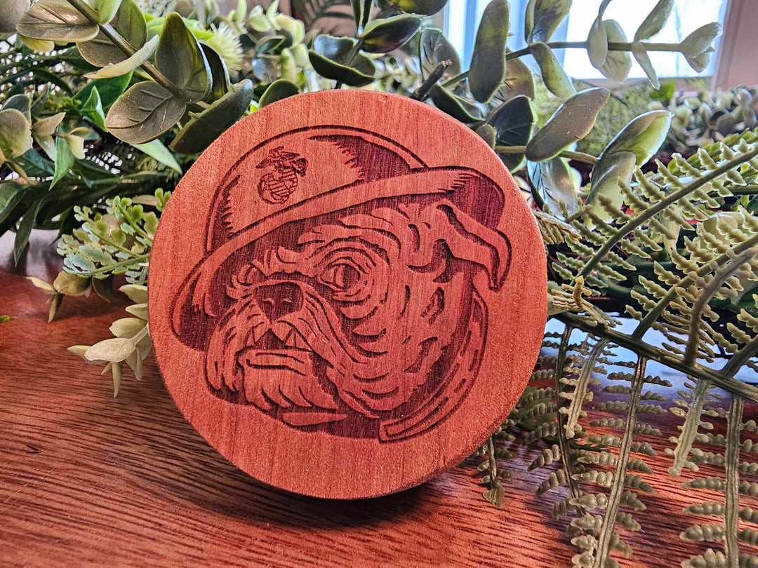 Wood Puck-Style Bottle Opener depicting a Marine Bull dog wearing a helmet with the eagle, globe, and anchor.